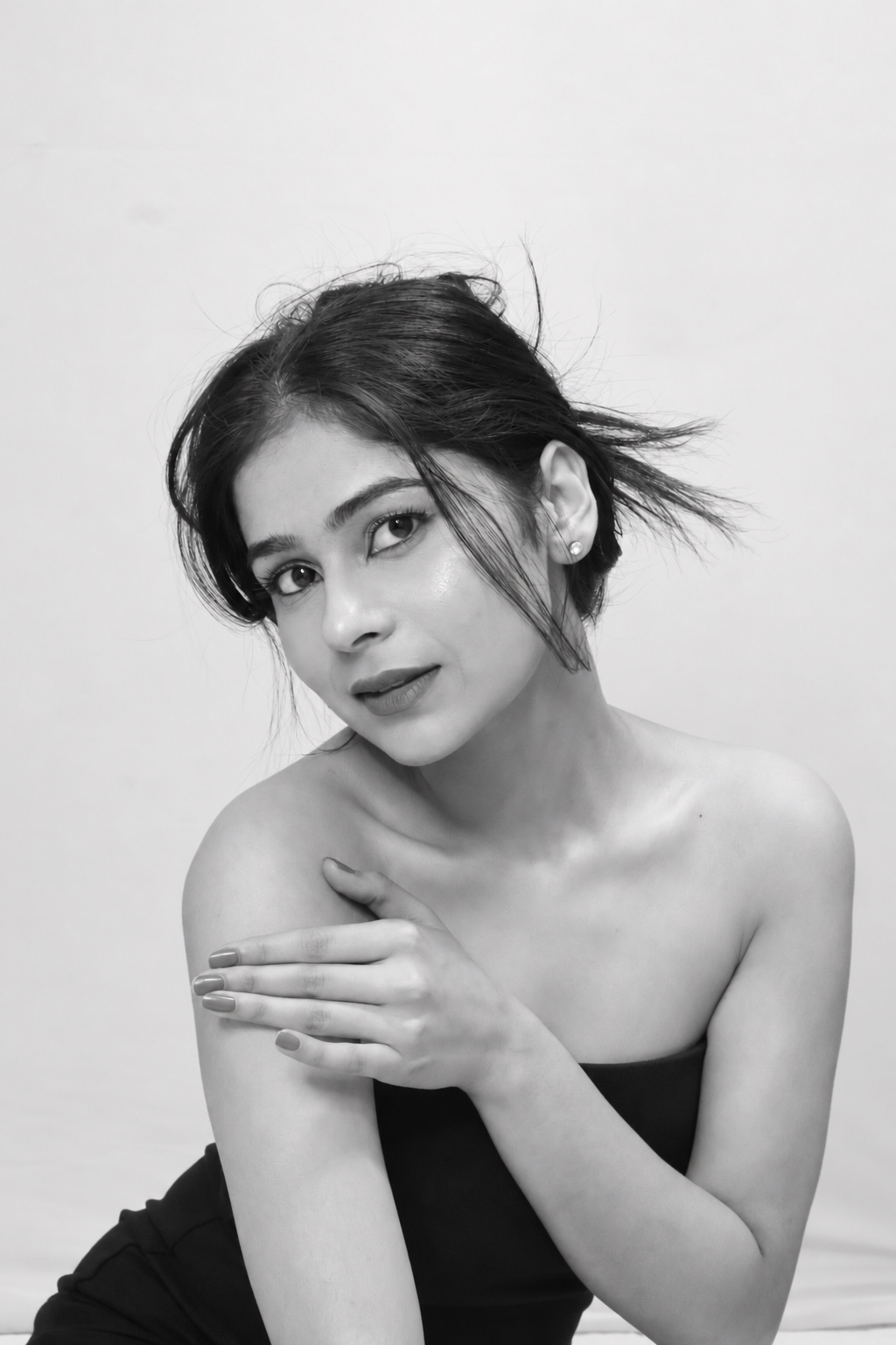 Komal Sandhu in a black and white studio portrait